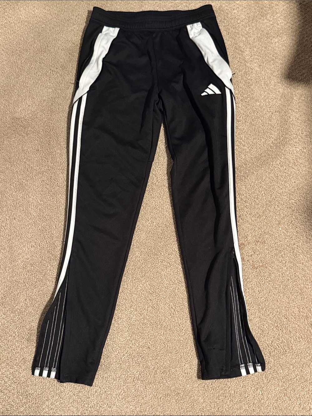 Black and white mens Adidas track pants.